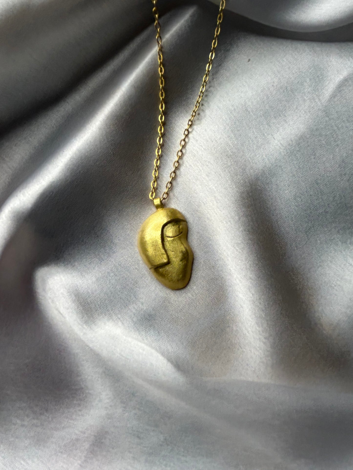 "SMIRK OFF" FACE NECKLACE